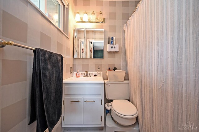 5638 Victoryview Ln, Delhi Twp, OH 45233 - bathroom with tile walls, toilet, vanity, and a shower with shower curtain