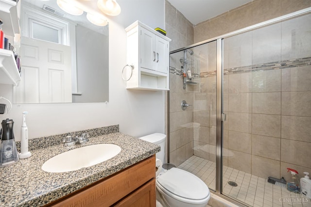 709 E Mcmillan St Unit 1, Cincinnati, OH 45206 - full bathroom featuring a stall shower, toilet, and vanity