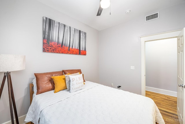 709 E Mcmillan St Unit 1, Cincinnati, OH 45206 - bedroom featuring wood finished floors, baseboards, and a ceiling fan