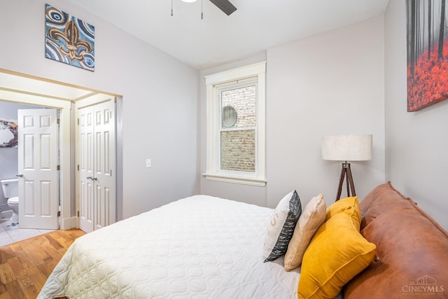 709 E Mcmillan St Unit 1, Cincinnati, OH 45206 - bedroom with wood finished floors, connected bathroom, and ceiling fan