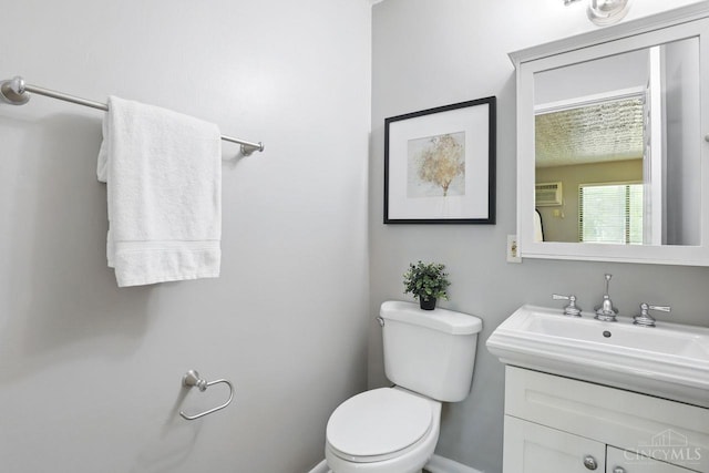 6607 Hearne Rd Unit 90, Green Twp, OH 45248 - half bath with a wall mounted AC, toilet, and vanity