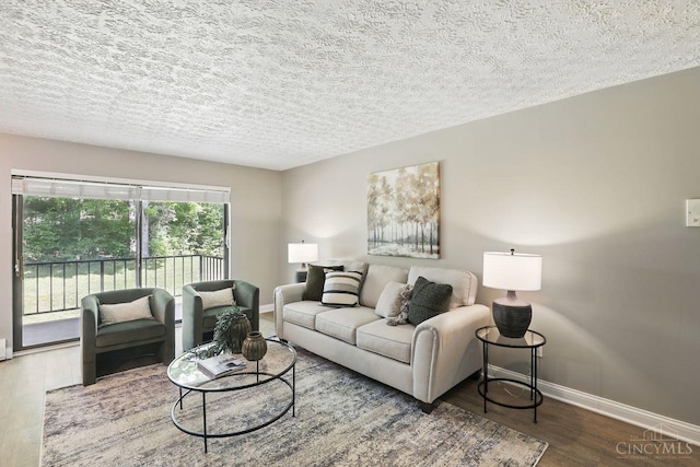 6607 Hearne Rd Unit 90, Green Twp, OH 45248 - living area with baseboards, wood finished floors, and a textured ceiling