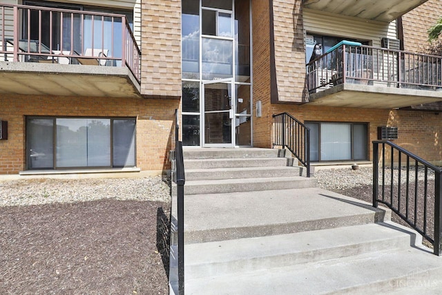 6607 Hearne Rd Unit 90, Green Twp, OH 45248 - doorway to property with brick siding and a balcony
