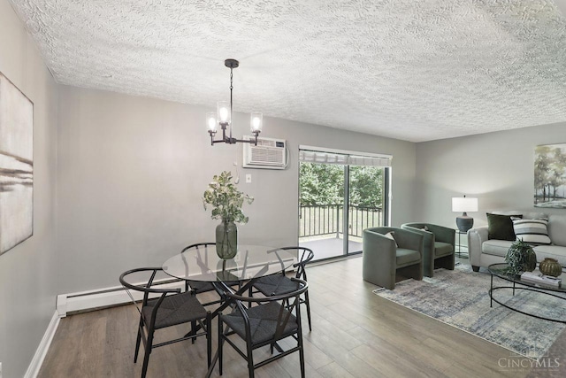 6607 Hearne Rd Unit 90, Green Twp, OH 45248 - dining room with wood finished floors, a wall mounted air conditioner, a textured ceiling, a chandelier, and baseboards
