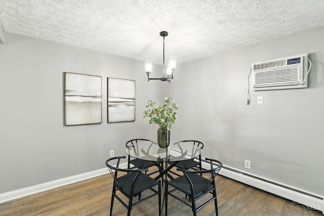 6607 Hearne Rd Unit 90, Green Twp, OH 45248 - dining room featuring a wall mounted AC, a chandelier, dark wood-style flooring, a baseboard heating unit, and a textured ceiling