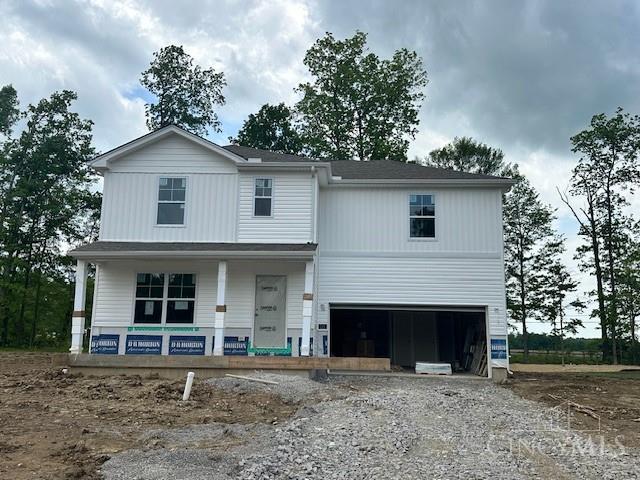 115 Cornerstone Dr, Williamsburg, OH 45176 - view of front of property with covered porch, an attached garage, and driveway