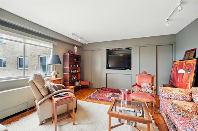 1617 E Mcmillan St Unit 605, Cincinnati, OH 45206 - living room with track lighting and wood finished floors