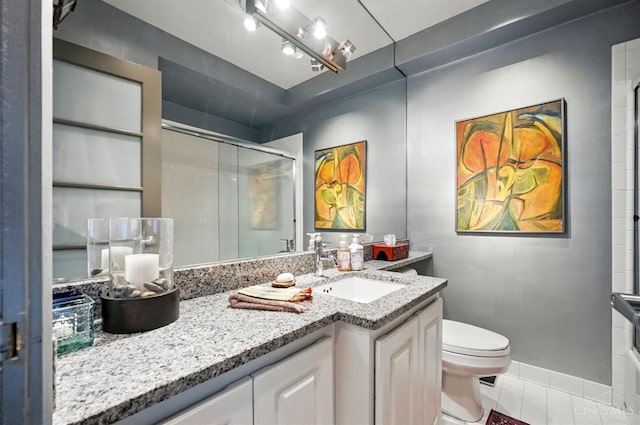 1617 E Mcmillan St Unit 605, Cincinnati, OH 45206 - full bath featuring an enclosed shower, vanity, and tile patterned flooring