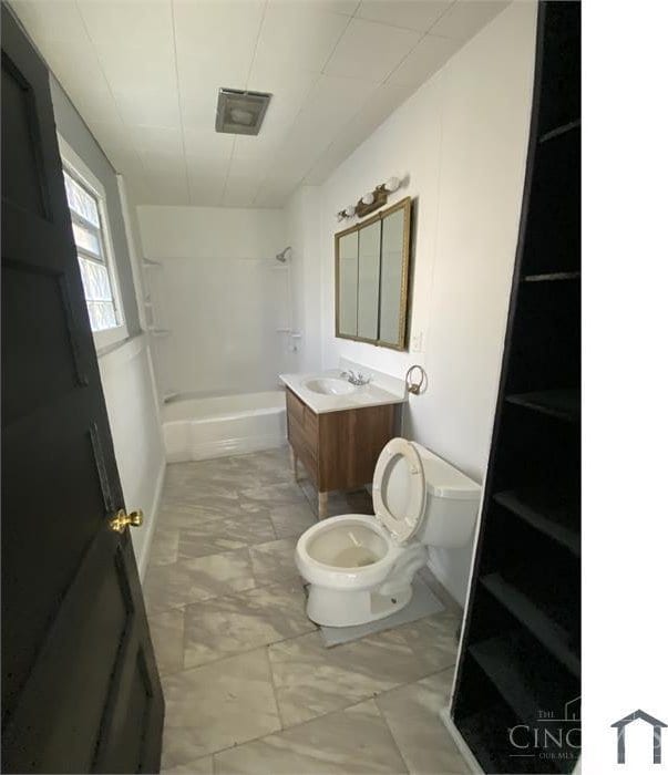 2196 Champlain St, Cincinnati, OH 45214 - bathroom with toilet, shower / tub combination, and vanity