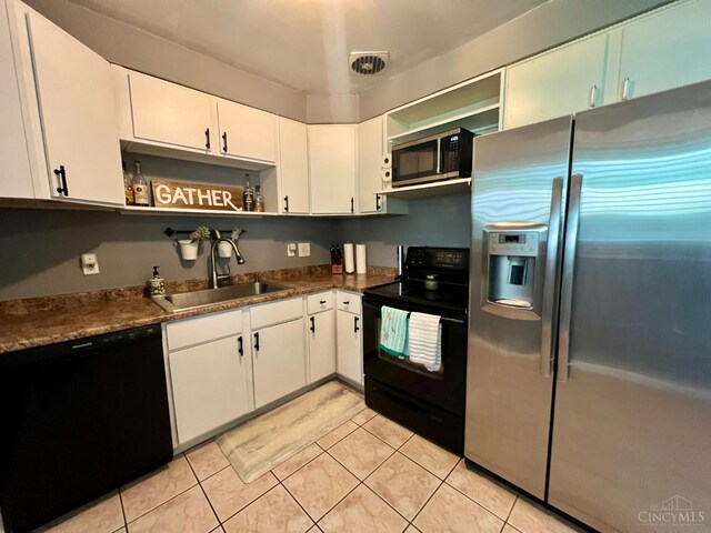 8608 Dundalk Ct, Sycamore Twp, OH 45236 - kitchen with black appliances, a sink, open shelves, dark countertops, and light tile patterned flooring