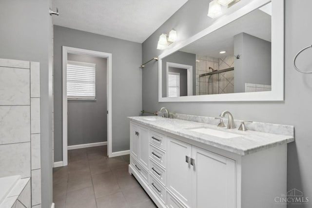 5 Artesian Ct, Springboro, OH 45066 - bathroom with tiled shower, double vanity, baseboards, tile patterned floors, and a bathtub