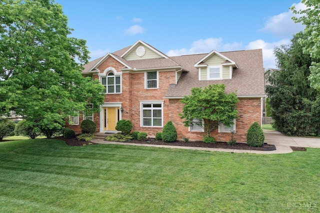 5 Artesian Ct, Springboro, OH 45066 - view of front facade featuring brick siding, a front lawn, a shingled roof, and concrete driveway