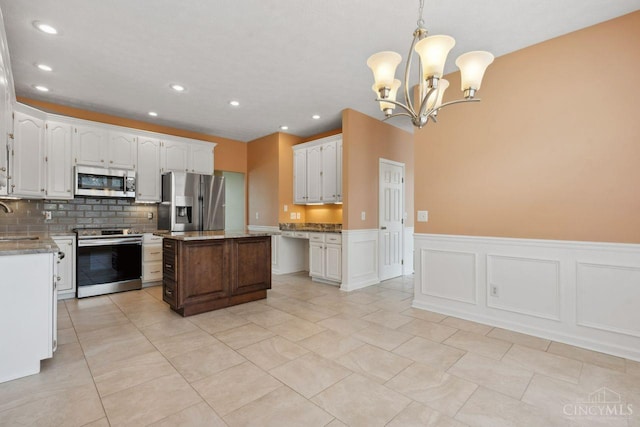 5 Artesian Ct, Springboro, OH 45066 - kitchen with stainless steel appliances, recessed lighting, a sink, backsplash, and white cabinetry