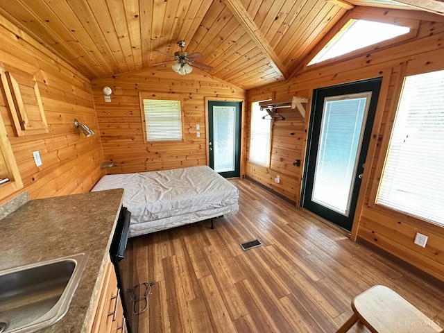 58 Wizard Of Oz Way, Paint Twp, OH 45133 - bedroom featuring vaulted ceiling, wooden walls, wood finished floors, a sink, and wood ceiling