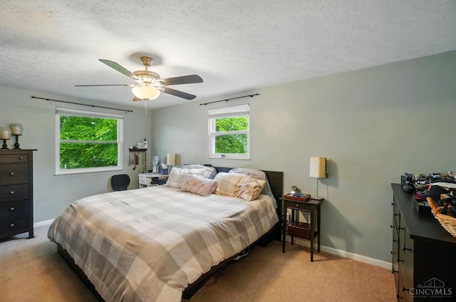 12056 Hazelhurst Ln, Springfield Twp, OH 45240 - bedroom featuring light carpet, baseboards, a textured ceiling, and a ceiling fan