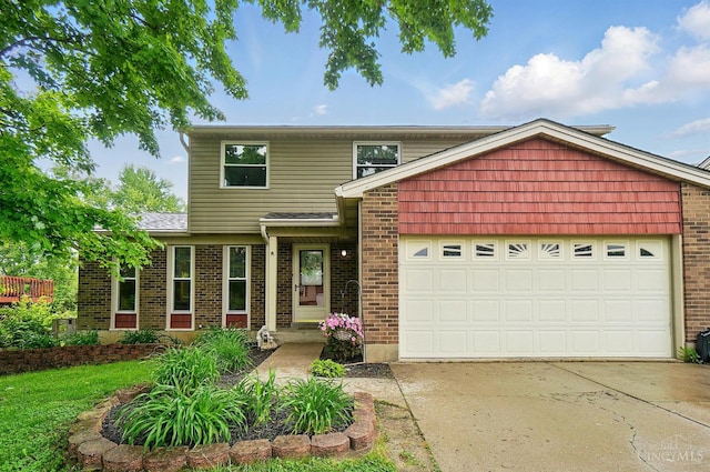 12056 Hazelhurst Ln, Springfield Twp, OH 45240 - traditional home with driveway, an attached garage, and brick siding