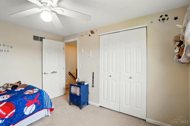 12056 Hazelhurst Ln, Springfield Twp, OH 45240 - bedroom with light carpet, a ceiling fan, a closet, and baseboards