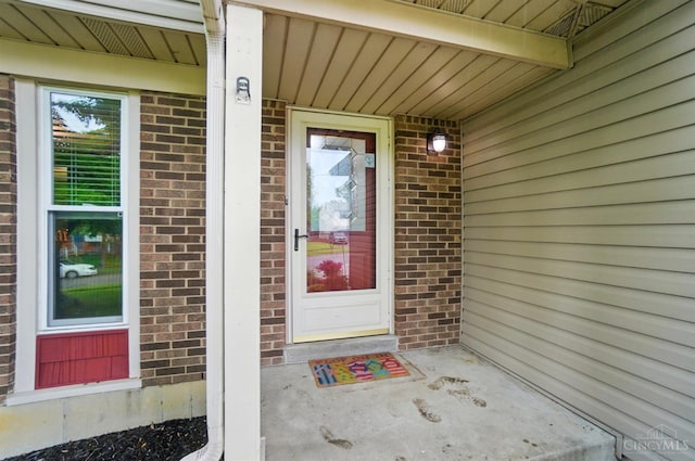 12056 Hazelhurst Ln, Springfield Twp, OH 45240 - property entrance featuring brick siding and a porch