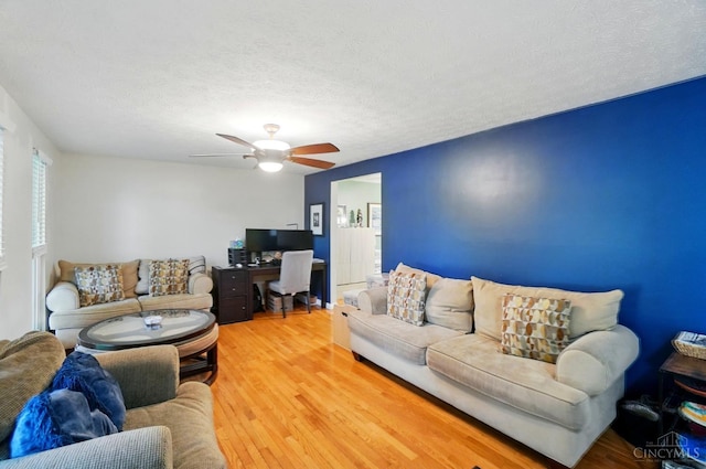 12056 Hazelhurst Ln, Springfield Twp, OH 45240 - living area with ceiling fan, light wood finished floors, and a textured ceiling