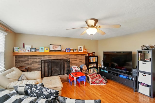 12056 Hazelhurst Ln, Springfield Twp, OH 45240 - living room with wood finished floors, a brick fireplace, and ceiling fan