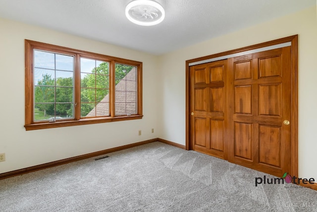 378 Natalie Ln, Turtle Creek Twp, OH 45036 - unfurnished bedroom featuring carpet flooring and baseboards