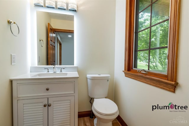 378 Natalie Ln, Turtle Creek Twp, OH 45036 - half bath featuring vanity, toilet, and plenty of natural light