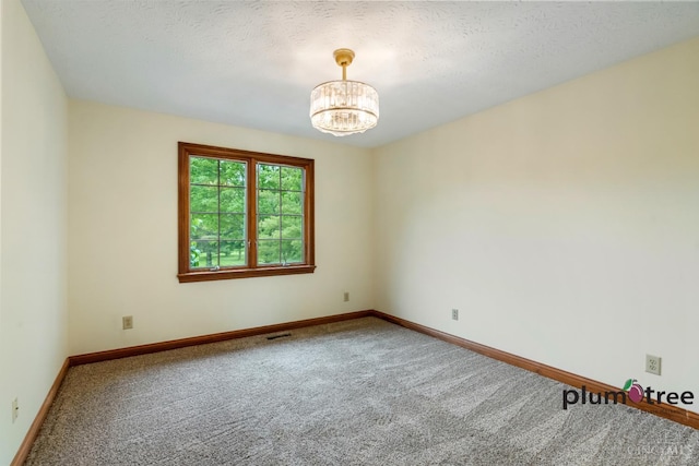 378 Natalie Ln, Turtle Creek Twp, OH 45036 - carpeted spare room with a chandelier, baseboards, and a textured ceiling