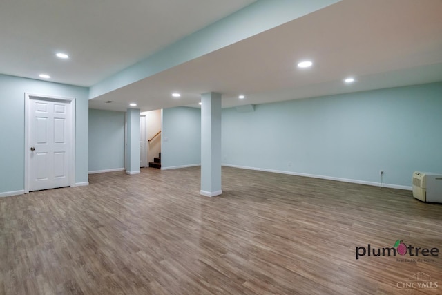 378 Natalie Ln, Turtle Creek Twp, OH 45036 - finished below grade area featuring wood finished floors, baseboards, recessed lighting, and stairway