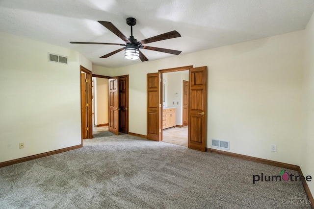 378 Natalie Ln, Turtle Creek Twp, OH 45036 - unfurnished bedroom featuring light carpet, baseboards, a ceiling fan, and ensuite bath
