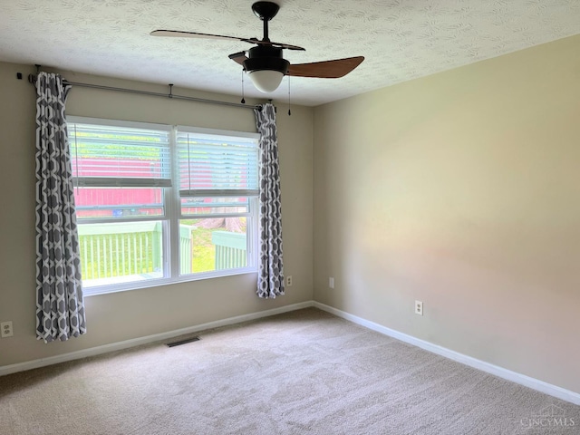 232 Choctaw Cir, Franklin, OH 45005 - spare room with a ceiling fan, healthy amount of natural light, carpet floors, baseboards, and a textured ceiling