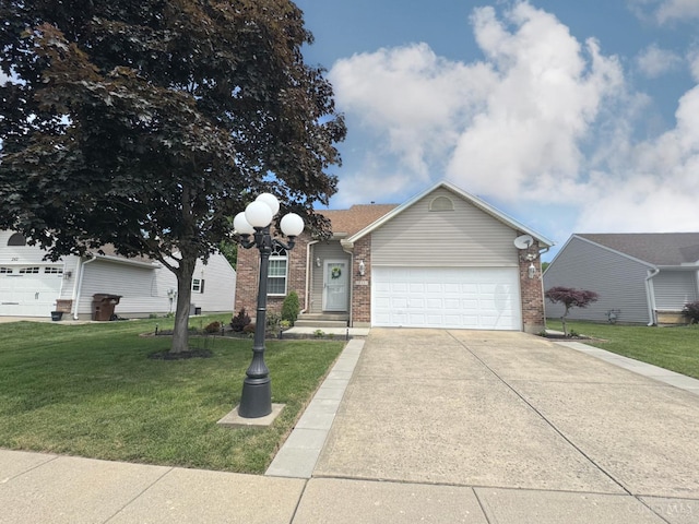 232 Choctaw Cir, Franklin, OH 45005 - view of front facade with a garage, concrete driveway, brick siding, and a front lawn