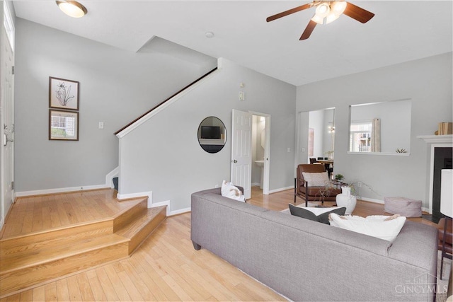 1441 Laurel Park Dr, Cincinnati, OH 45214 - living area featuring stairway, a ceiling fan, wood-type flooring, and baseboards