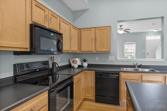 1441 Laurel Park Dr, Cincinnati, OH 45214 - kitchen with black appliances, a sink, dark countertops, and ceiling fan