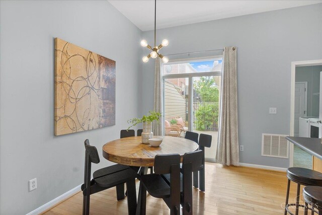 1441 Laurel Park Dr, Cincinnati, OH 45214 - dining room with light wood finished floors, baseboards, and a chandelier