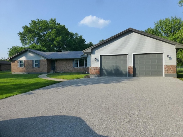 7274 Frey Rd, Goshen Twp, OH 45122 - ranch-style house with brick siding, a front lawn, driveway, and a garage