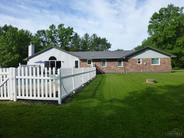 7274 Frey Rd, Goshen Twp, OH 45122 - rear view of house with brick siding, a pool, and a chimney