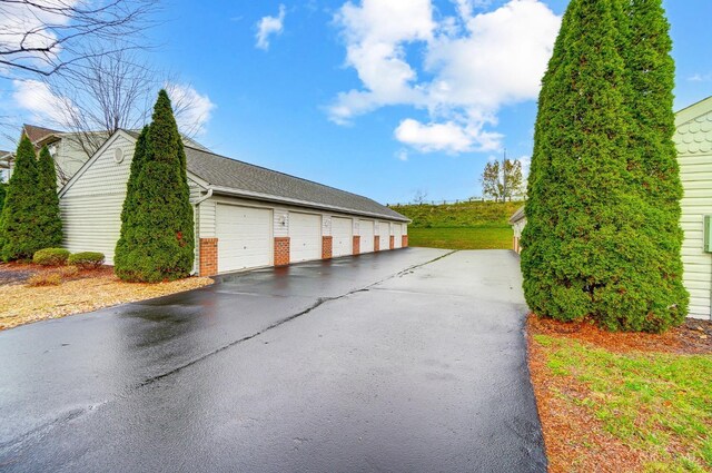 10350 W Rd Unit 34, Harrison, OH 45030 - view of side of property featuring community garages and brick siding