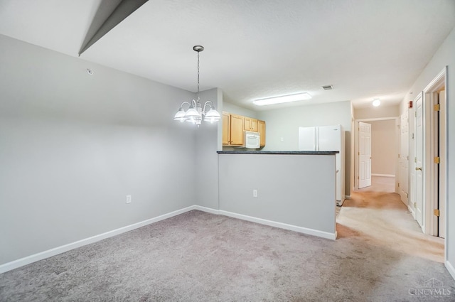 10350 W Rd Unit 34, Harrison, OH 45030 - unfurnished room featuring light carpet, a chandelier, and baseboards