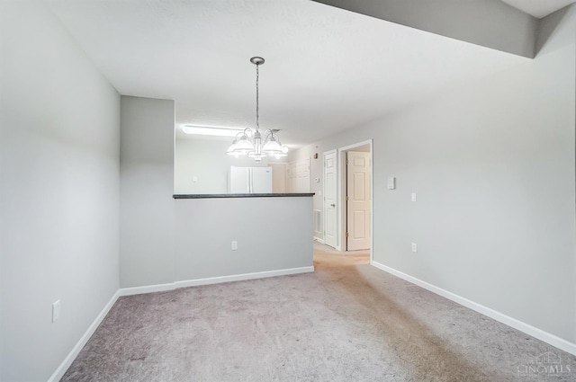 10350 W Rd Unit 34, Harrison, OH 45030 - carpeted spare room featuring a chandelier and baseboards