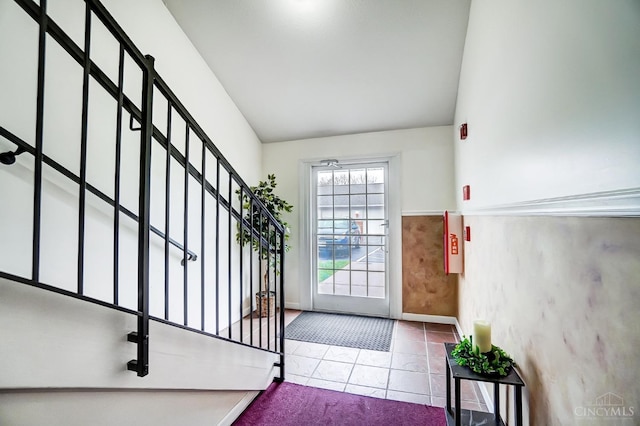10350 W Rd Unit 34, Harrison, OH 45030 - foyer entrance featuring stairway, tile patterned floors, lofted ceiling, and baseboards