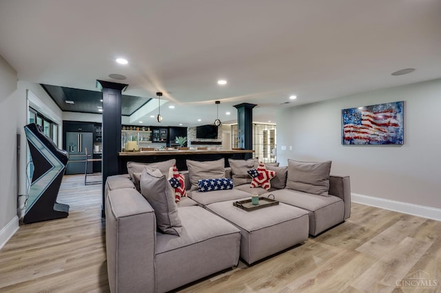 1941 Legendary Way, Clearcreek Twp, OH 45036 - living room featuring decorative columns, baseboards, light wood-style flooring, and recessed lighting