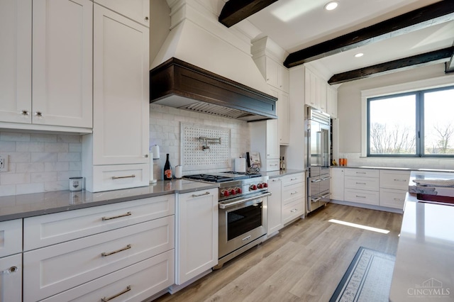 1941 Legendary Way, Clearcreek Twp, OH 45036 - kitchen featuring high quality appliances, decorative backsplash, beamed ceiling, white cabinets, and recessed lighting