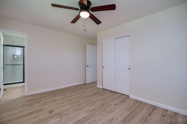 2389 Aquarius Dr, Springfield Twp, OH 45231 - unfurnished bedroom with light wood finished floors, baseboards, a closet, connected bathroom, and a ceiling fan