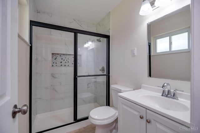 2389 Aquarius Dr, Springfield Twp, OH 45231 - bathroom featuring toilet, a shower stall, and vanity