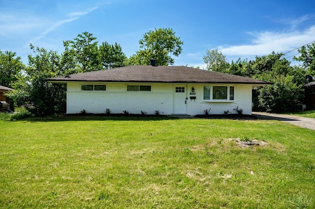 2389 Aquarius Dr, Springfield Twp, OH 45231 - view of front facade with brick siding and a front yard
