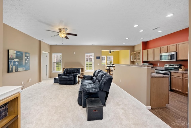 164 Shanda Dr, Monroe, OH 45040 - carpeted living room with recessed lighting, ceiling fan, and baseboards