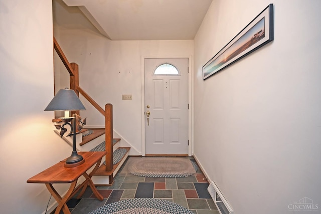 667 N Meadowcrest Cir, Springfield Twp, OH 45231 - doorway to outside with stairway and baseboards