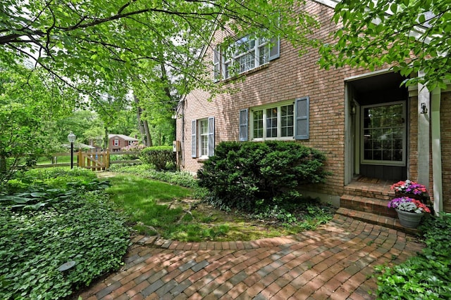 667 N Meadowcrest Cir, Springfield Twp, OH 45231 - view of home's exterior featuring brick siding