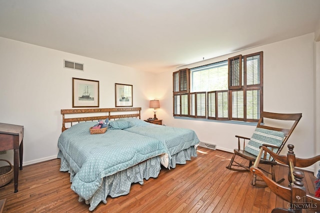667 N Meadowcrest Cir, Springfield Twp, OH 45231 - bedroom with hardwood / wood-style flooring and baseboards
