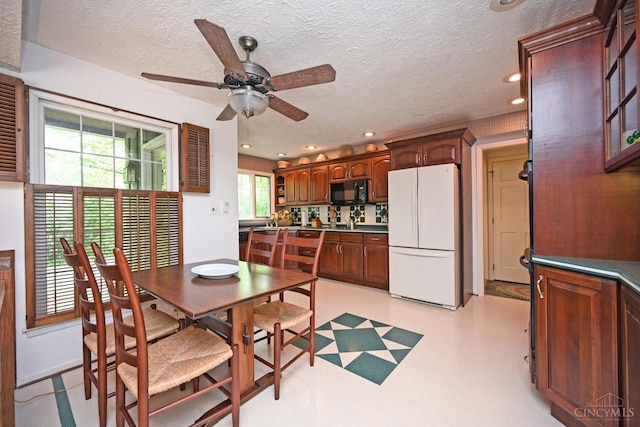 667 N Meadowcrest Cir, Springfield Twp, OH 45231 - dining room with ceiling fan, a textured ceiling, and recessed lighting